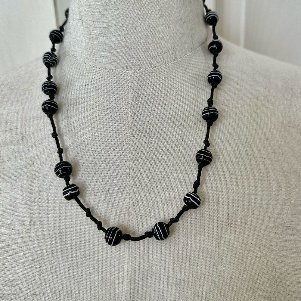 Black and white beaded necklace on cord
